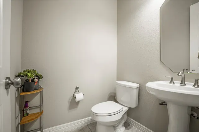 a bathroom with a sink toilet and vanity