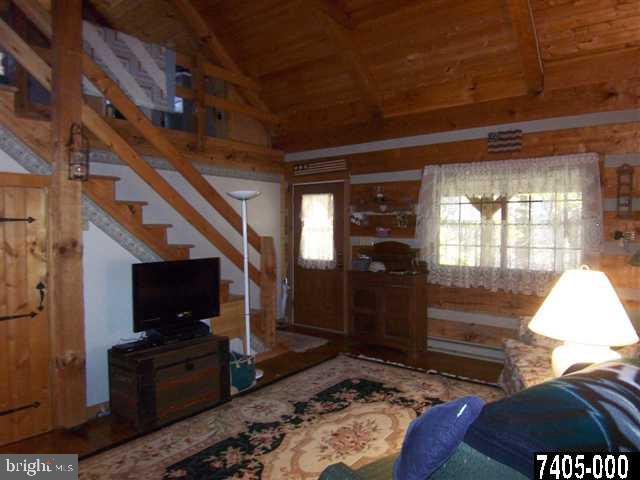 7728 Gnatstown Road Hanover, PA 17331 - Photo 22 of 25 a living room with furniture and a flat screen tv