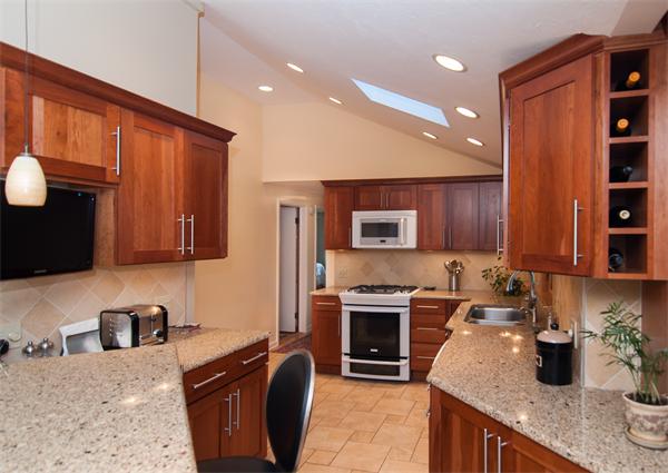 14 Colorado Street Springfield, MA 01118 - Photo 7 of 22 a kitchen with granite countertop a sink a stove and cabinets