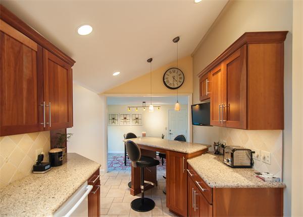 14 Colorado Street Springfield, MA 01118 - Photo 10 of 22 a kitchen with a refrigerator and a stove top oven