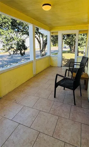 a view of a terrace with furniture and window