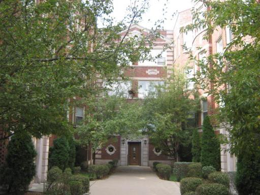 8142 South Drexel Avenue, Unit G Chicago, IL 60619 - Photo 2 of 11 a view of a city with lush green forest