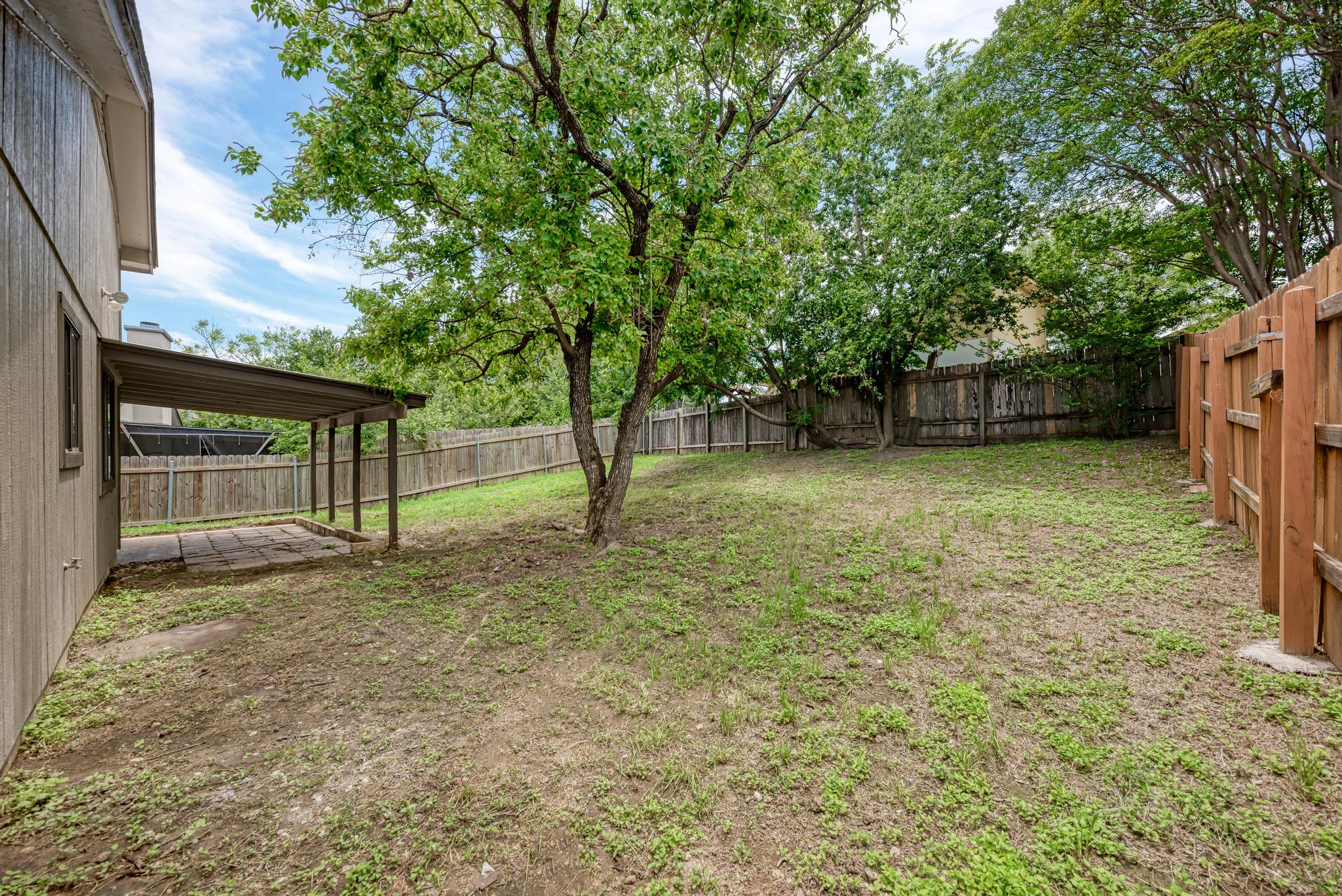 12108 Carnforth Drive Austin, TX 78753 - Photo 33 of 33 a view of a yard with wooden fence