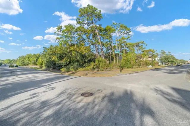 a view of road with a building in the background