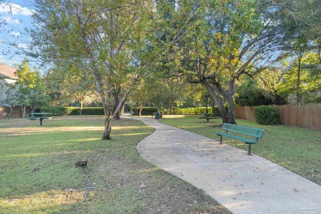 a view of a swimming pool with an outdoor space and seating area