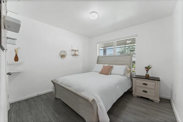 a bedroom with a bed and dresser