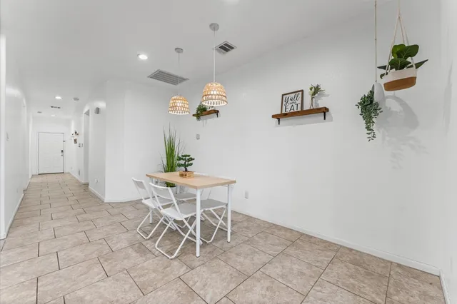 a view of a dining room with furniture