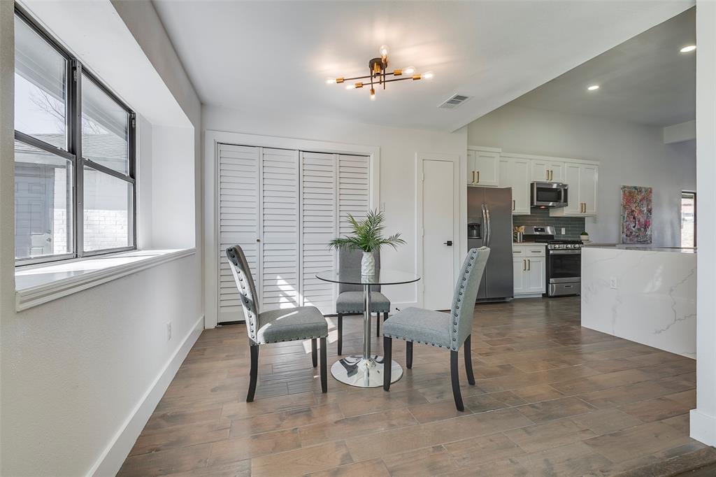5607 Emrose Circle Dallas, TX 75227 - Photo 11 of 25 a view of a dining room with furniture and a chandelier