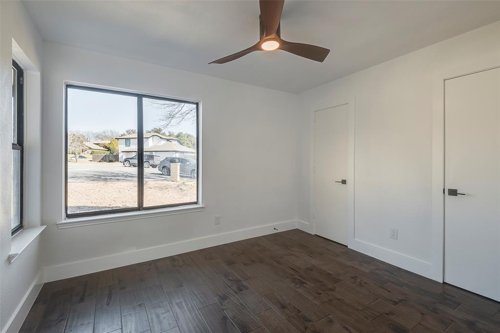 5607 Emrose Circle Dallas, TX 75227 - Photo 18 of 25 a view of an empty room with wooden floor and a window