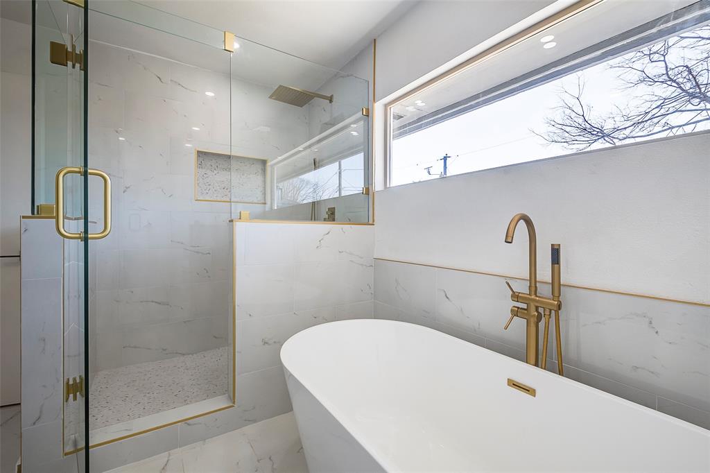 5607 Emrose Circle Dallas, TX 75227 - Photo 23 of 25 a bathroom with a bathtub and shower