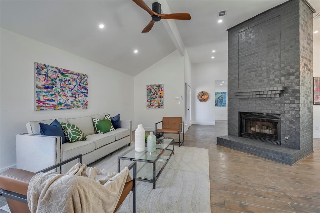 5607 Emrose Circle Dallas, TX 75227 - Photo 6 of 25 a living room with furniture and a fireplace