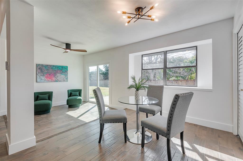 5607 Emrose Circle Dallas, TX 75227 - Photo 10 of 25 a view of a dining room with furniture window and wooden floor