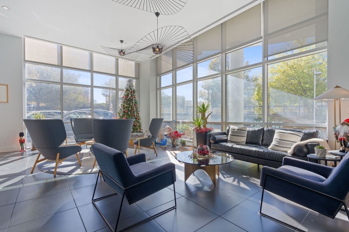 603 Davis Street, Unit 1304 Austin, TX 78701 - Photo 40 of 40 a living room with furniture and a floor to ceiling window