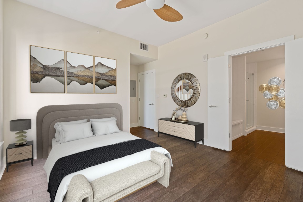 603 Davis Street, Unit 1304 Austin, TX 78701 - Photo 5 of 40 a bedroom with a bed and wooden floor