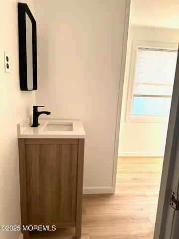 a bathroom with a sink and a mirror