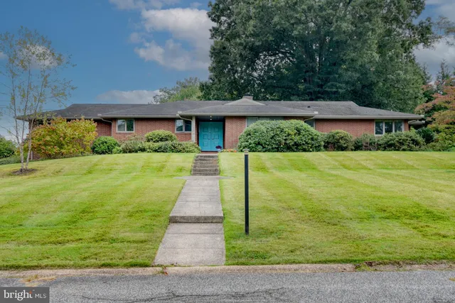 a front view of a house with yard