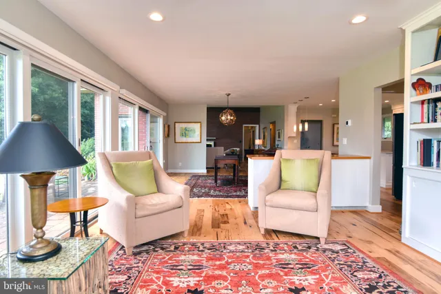 a living room with furniture and a table