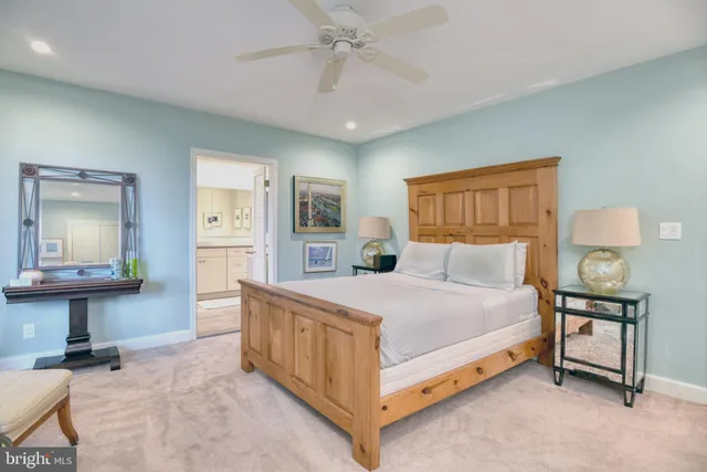 a bedroom with a bed and a table in it