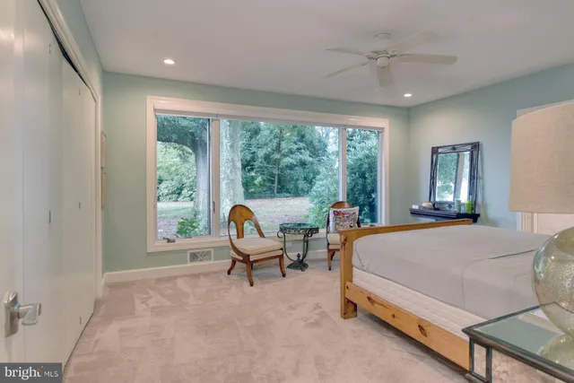 a bed room with a bed and a window