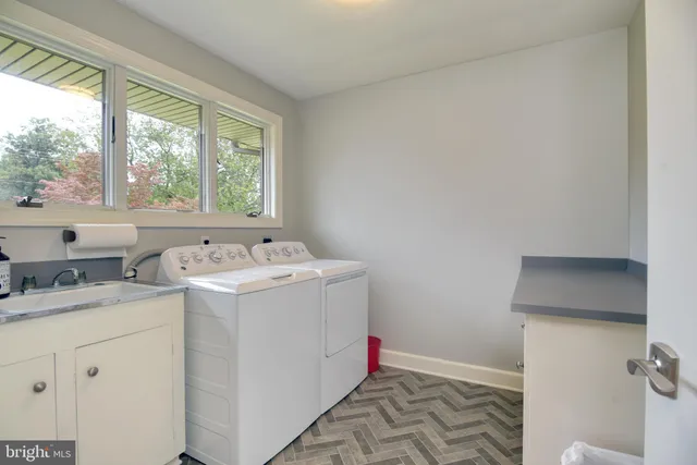 a utility room with dryer and washer