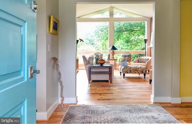 a living room with fireplace furniture and a window