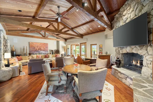a view of a house with backyard porch and sitting area