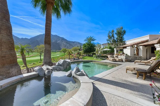 a bathroom with a granite countertop sink mirror and double