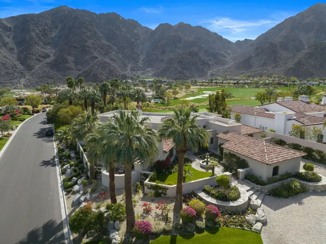 a view of a city with mountains in the background