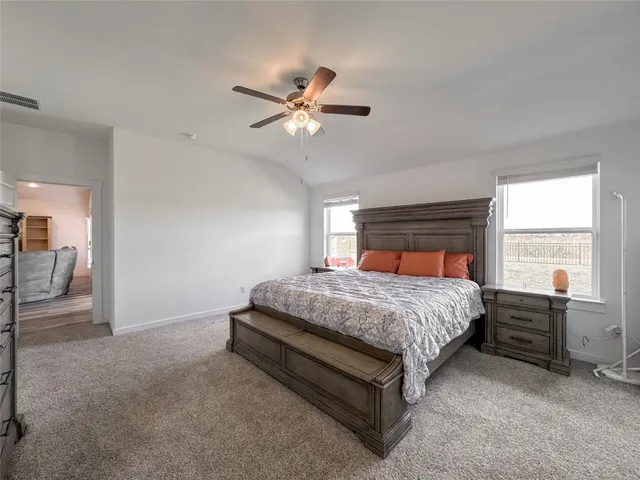 a bedroom with a bed and window