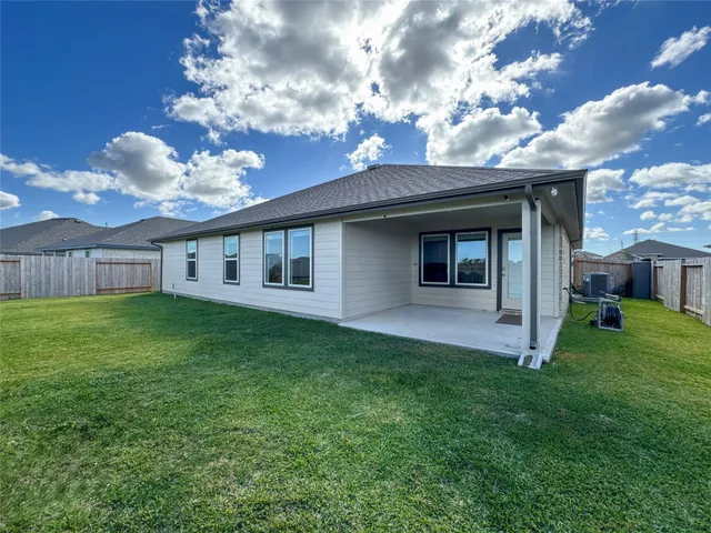 a view of a house with a back yard