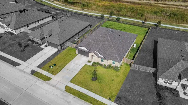 an aerial view of a house with a ocean view