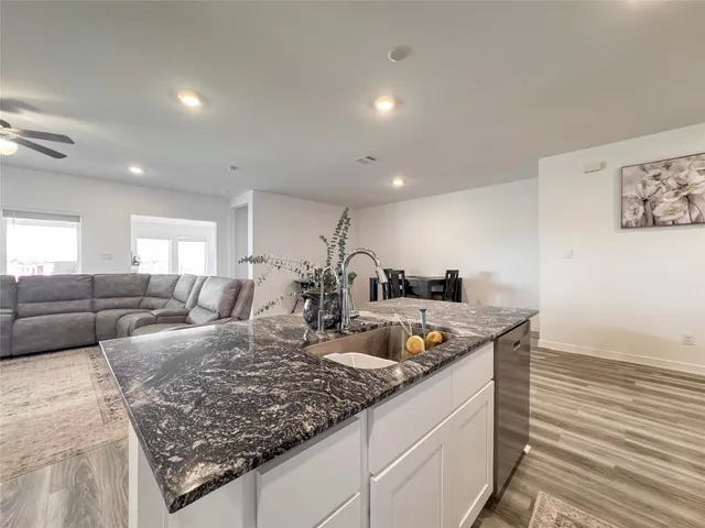 a large living room with granite countertop