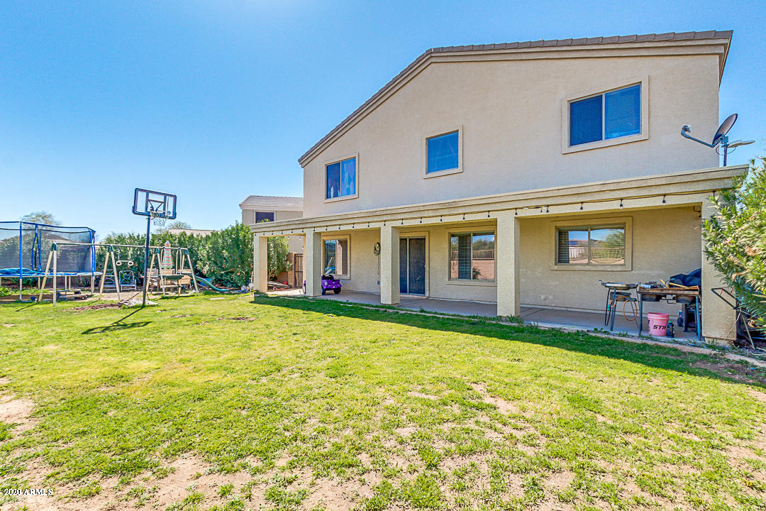 19079 North Leland Road Maricopa, AZ 85138 - Photo 42 of 51 a view of a house with pool and chairs