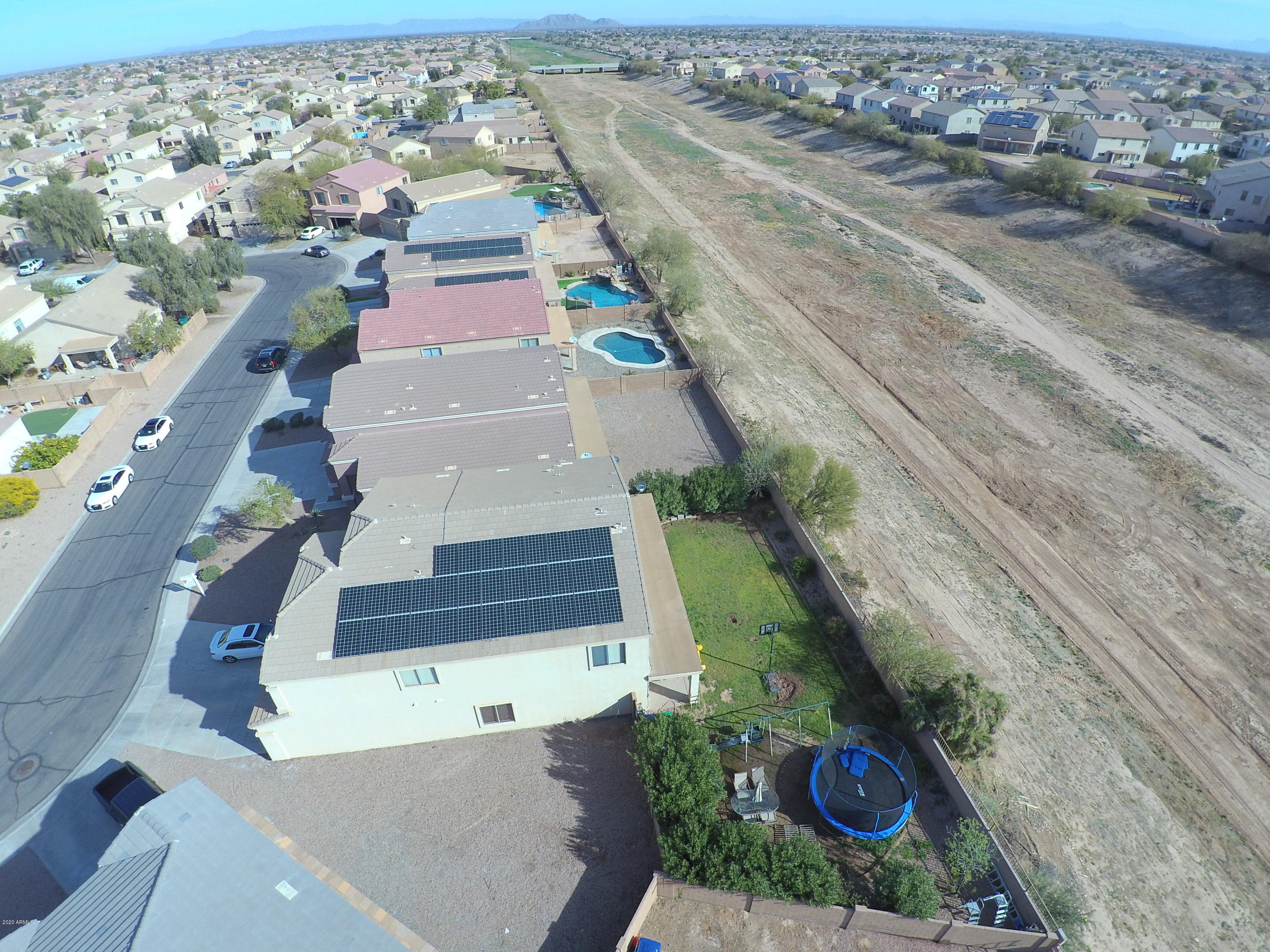 19079 North Leland Road Maricopa, AZ 85138 - Photo 50 of 51 an aerial view of residential houses with outdoor space