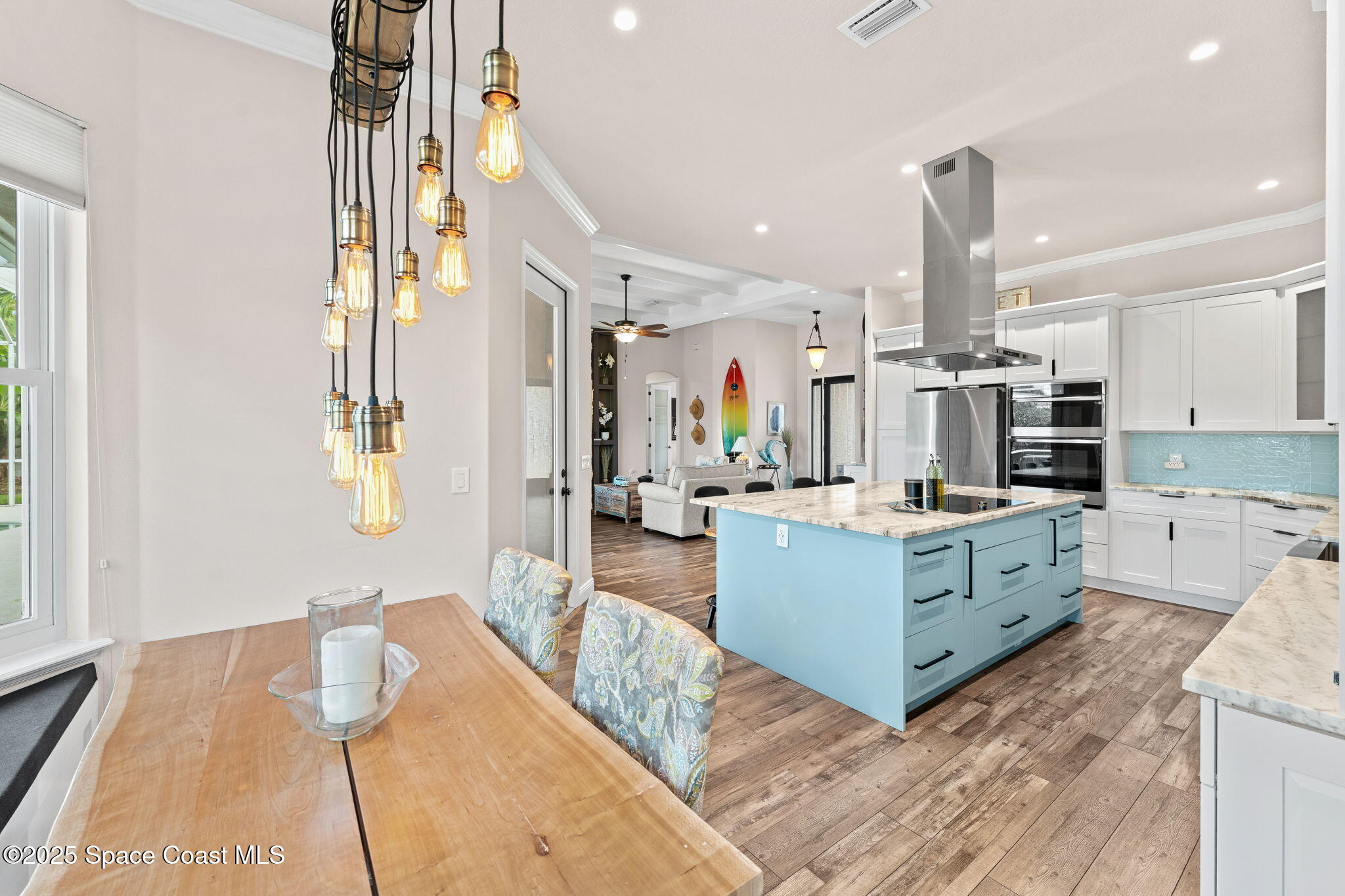 162 Miami Avenue Indialantic, FL 32903 - Photo 14 of 49 a large white kitchen with kitchen island a large counter space a sink stainless steel appliances and cabinets