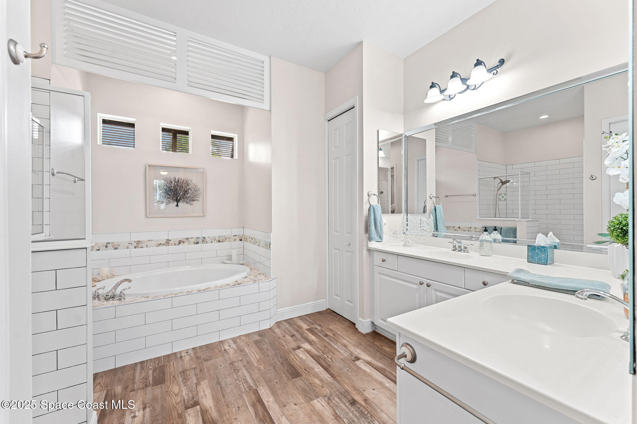 162 Miami Avenue Indialantic, FL 32903 - Photo 18 of 49 a spacious bathroom with a tub sink and mirror