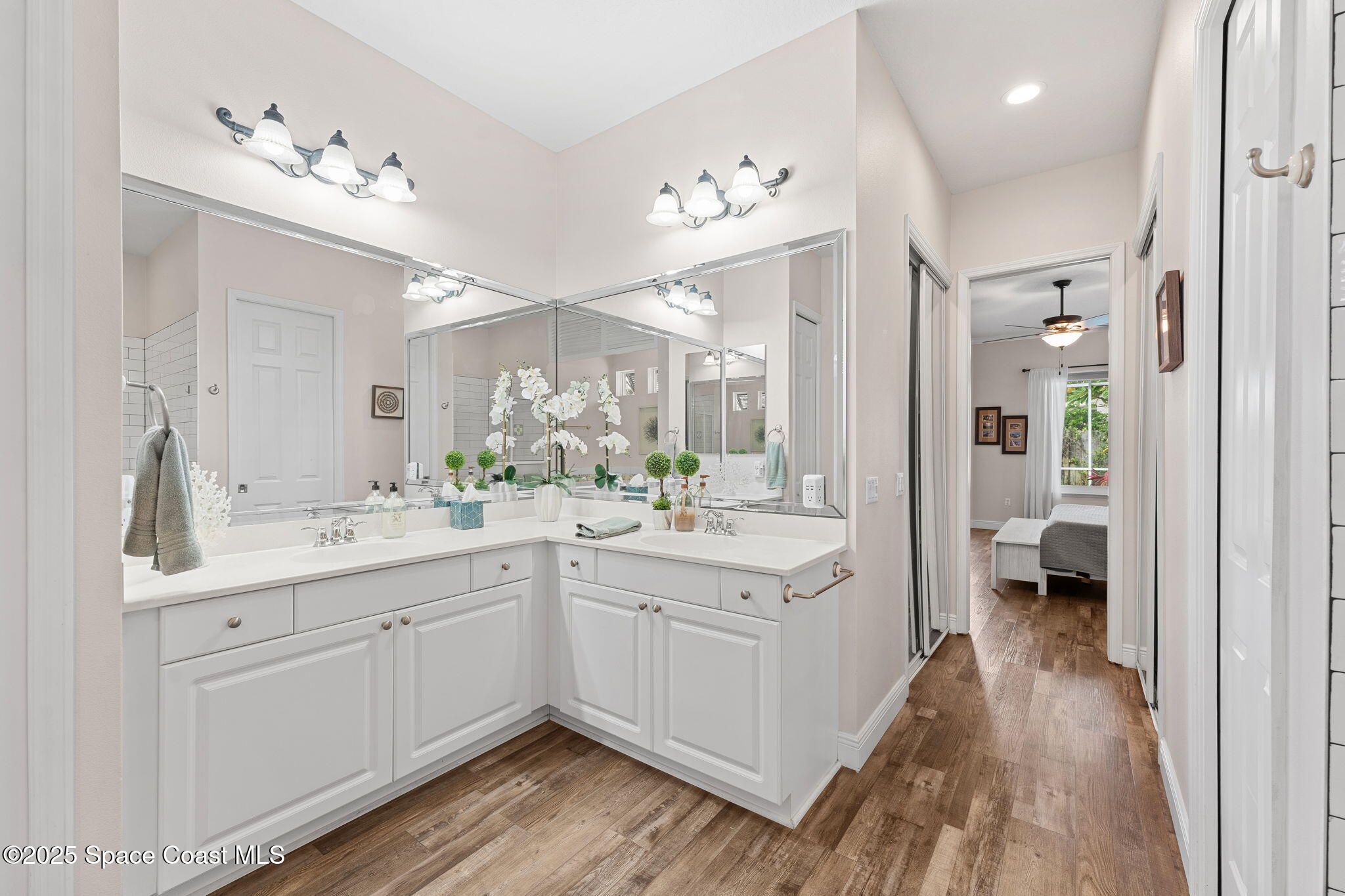 162 Miami Avenue Indialantic, FL 32903 - Photo 19 of 49 a spacious bathroom with a double vanity sink and a mirror