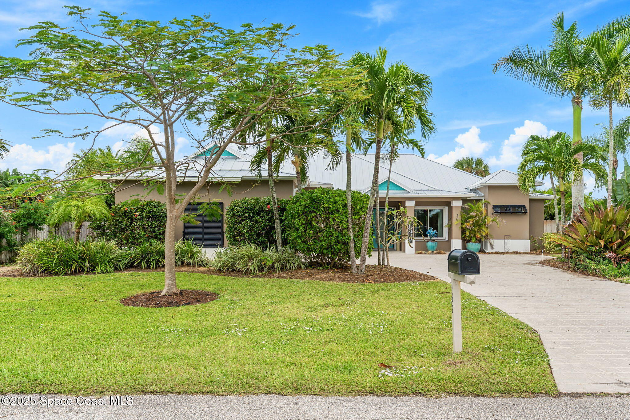 162 Miami Avenue Indialantic, FL 32903 - Photo 2 of 49 a view of a house with a yard