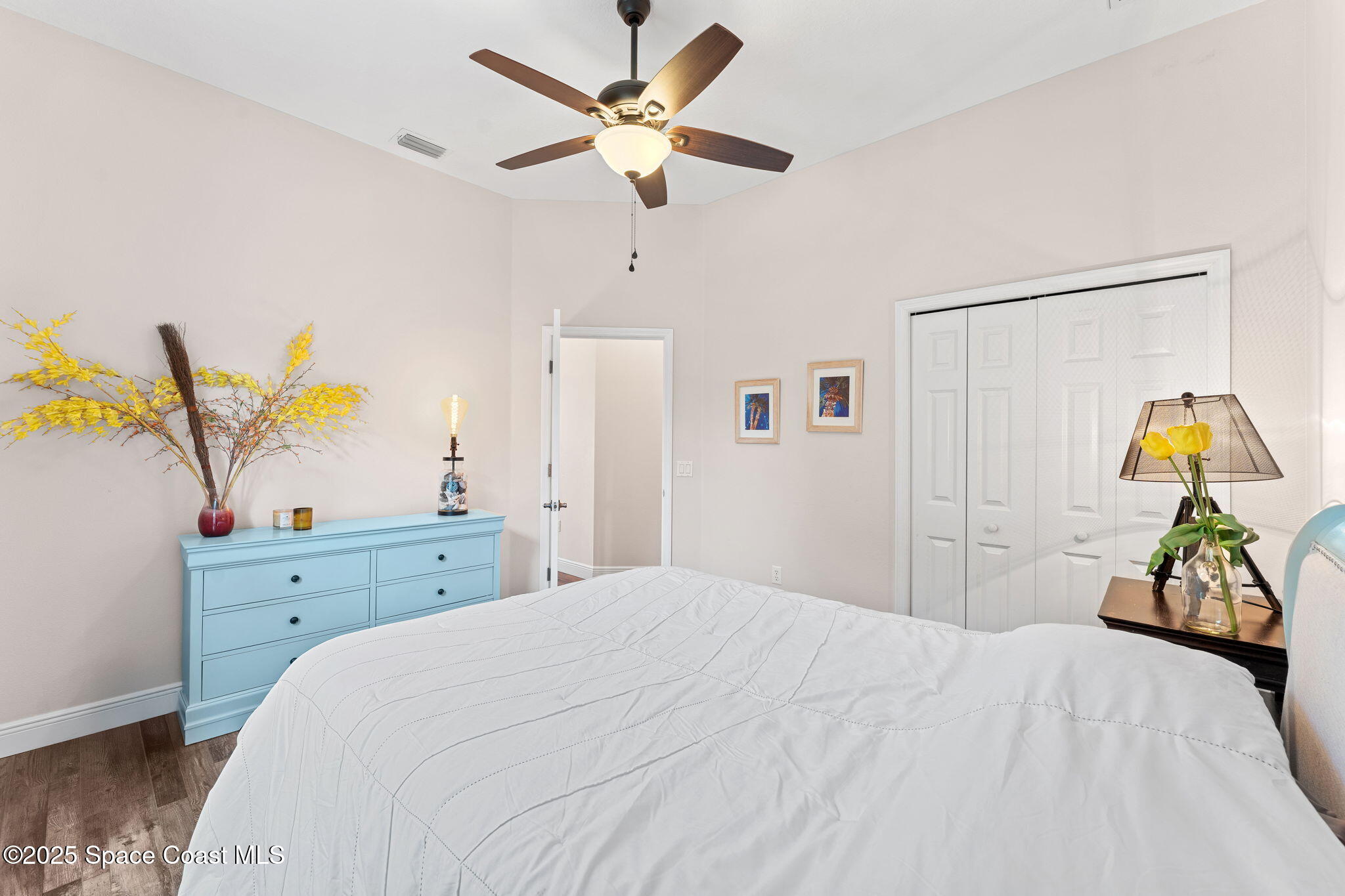 162 Miami Avenue Indialantic, FL 32903 - Photo 25 of 49 a bedroom with a bed and a dresser