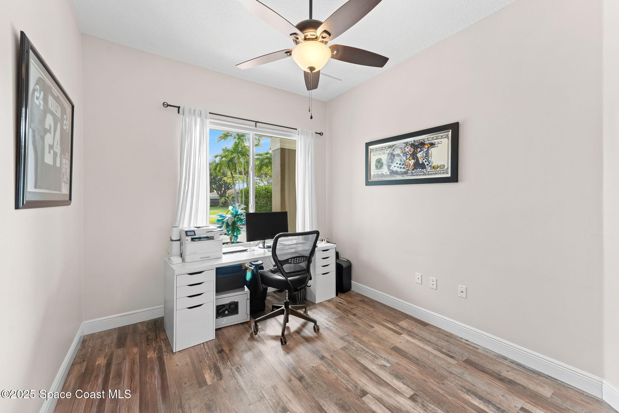 162 Miami Avenue Indialantic, FL 32903 - Photo 27 of 49 a view of a workspace with furniture and a window