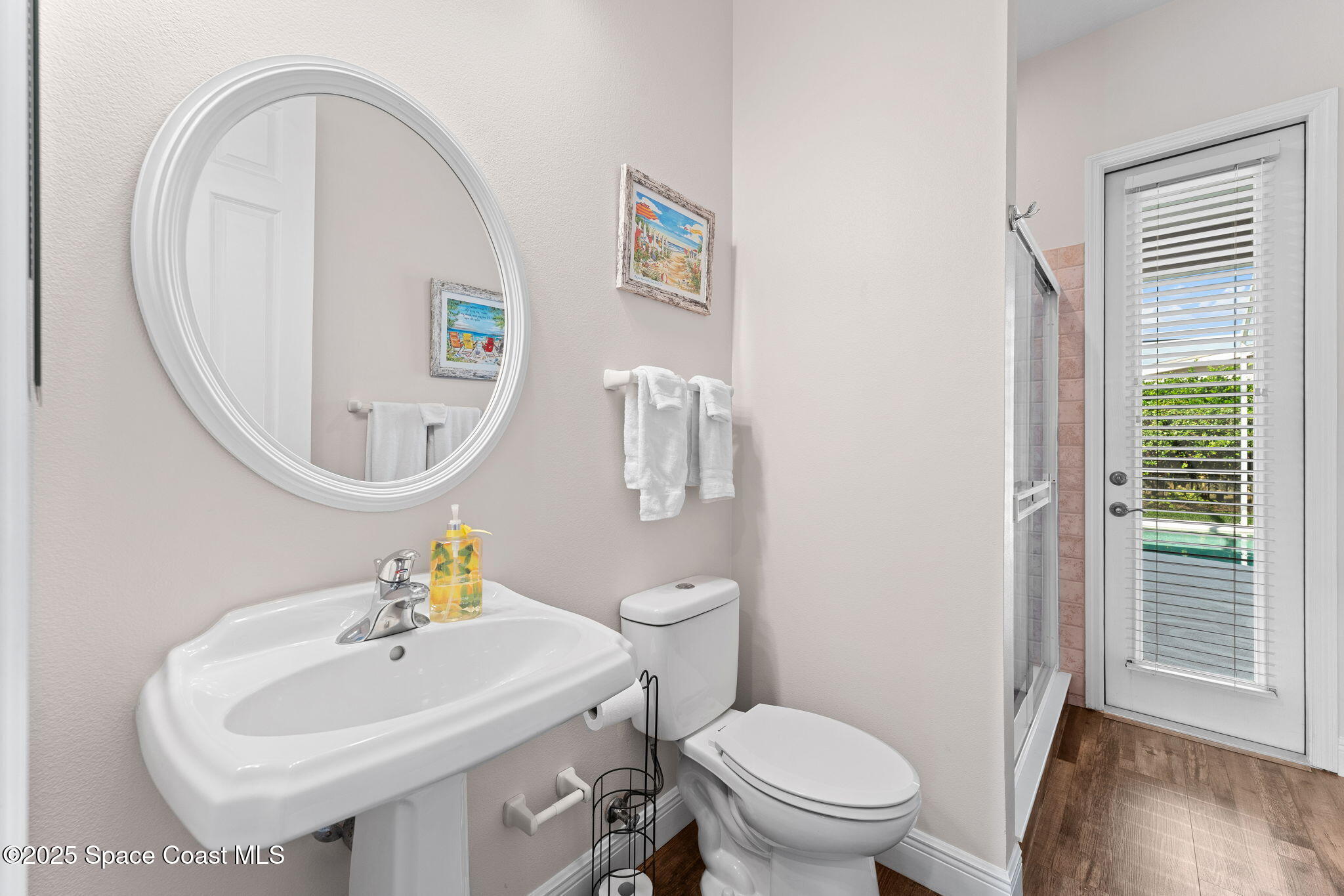 162 Miami Avenue Indialantic, FL 32903 - Photo 29 of 49 a bathroom with a sink a toilet and a mirror