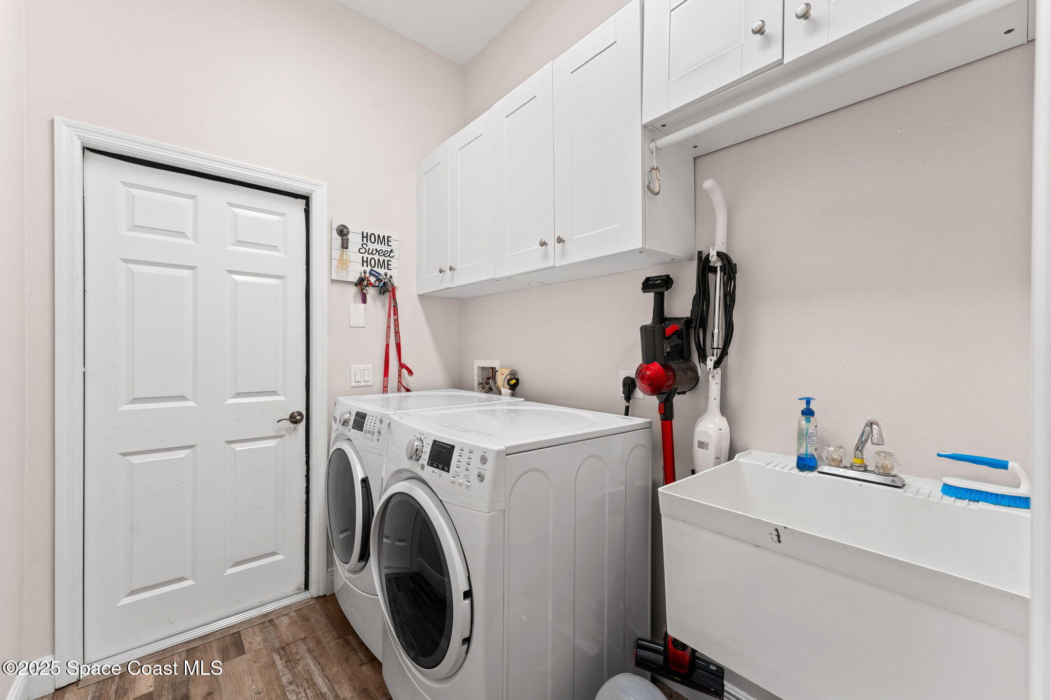 162 Miami Avenue Indialantic, FL 32903 - Photo 30 of 49 a view of storage and utility room with washer and dryer
