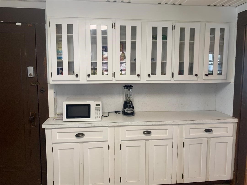147 Belvidere Street Springfield, MA 01108 - Photo 11 of 27 a kitchen with a stove and a white cabinet