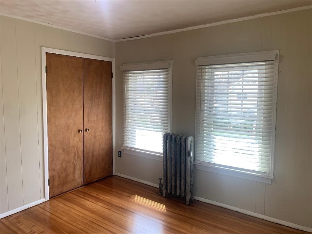147 Belvidere Street Springfield, MA 01108 - Photo 19 of 27 a view of an empty room with wooden floor and a window