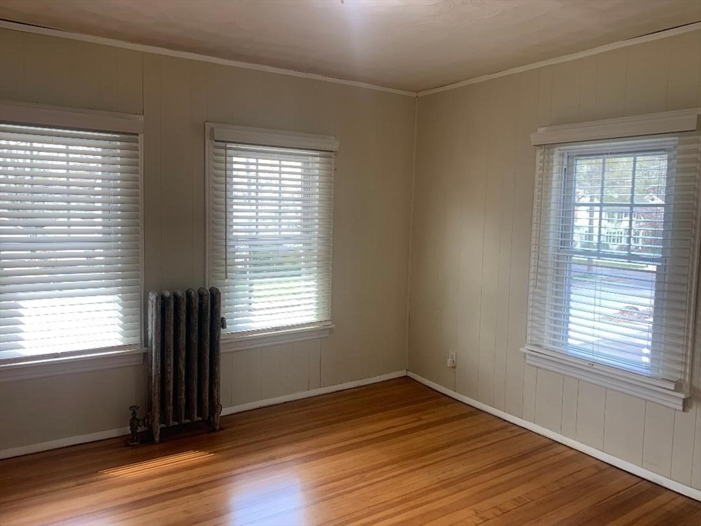 147 Belvidere Street Springfield, MA 01108 - Photo 20 of 27 a view of an empty room with wooden floor and a window