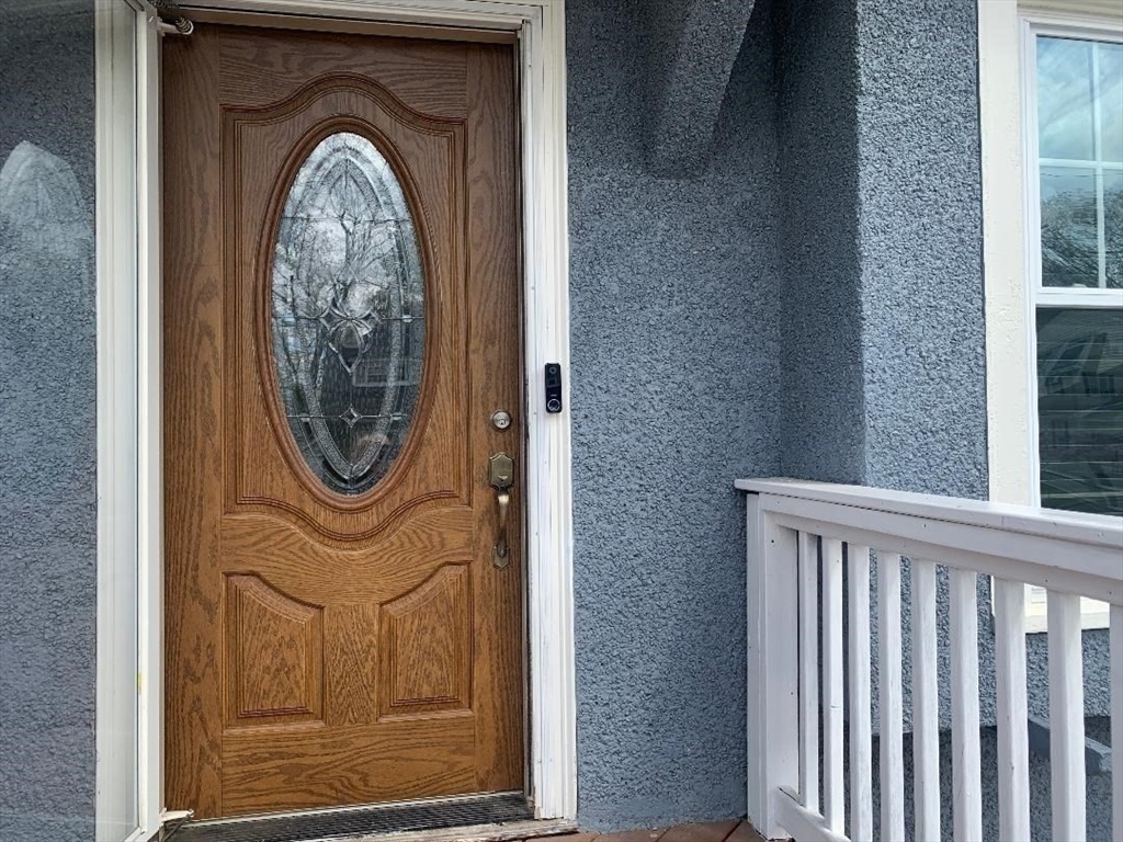 147 Belvidere Street Springfield, MA 01108 - Photo 5 of 27 a view of a door with wooden fence