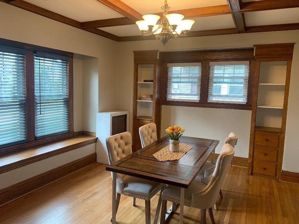 147 Belvidere Street Springfield, MA 01108 - Photo 6 of 27 a view of a dining room with furniture a chandelier and wooden floor