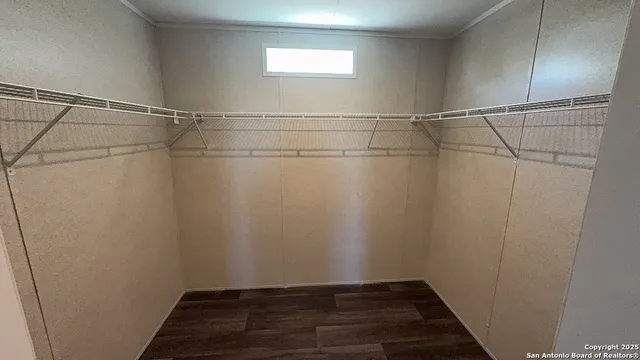 a view of a room with racks on the wall