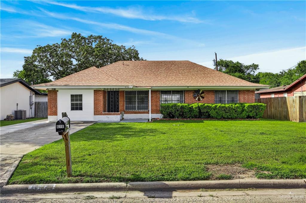 616 5th Street Weslaco, TX 78596 - Photo 16 of 33 a front view of a house with a garden
