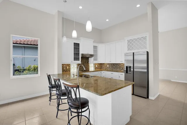a kitchen with a sink and refrigerator